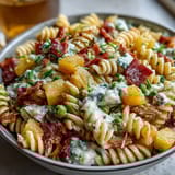 Colorful Hawaiian Pasta Salad with Ham, Pineapple, and Ranch, featuring crunchy vegetables and sweet fruit for a refreshing summer meal.  