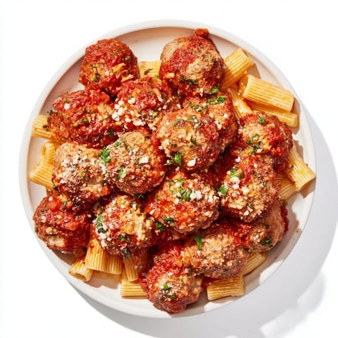 Steaming plate of savory turkey meatballs in rich tomato sauce, ready to serve with pasta.