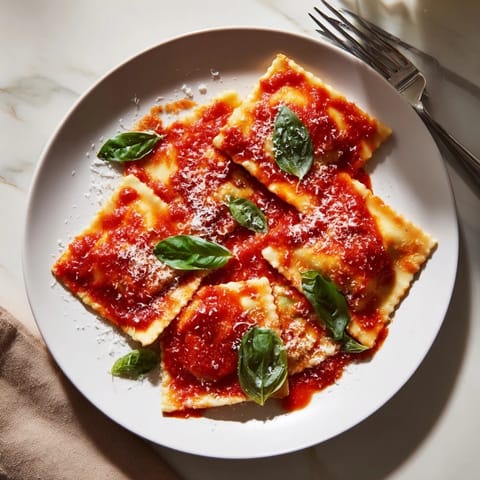 Tender ravioli filled with creamy ricotta and fresh spinach, drizzled with warm marinara and finished with fragrant basil.