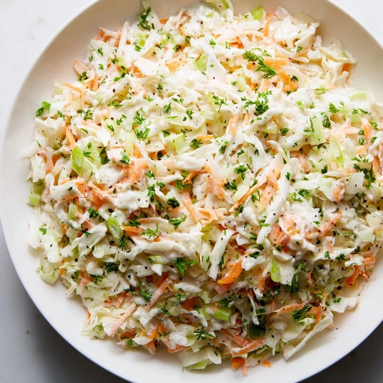 Zoom in on this vibrant Coleslaw with Apple: expect a tangy taste with a homemade dressing.