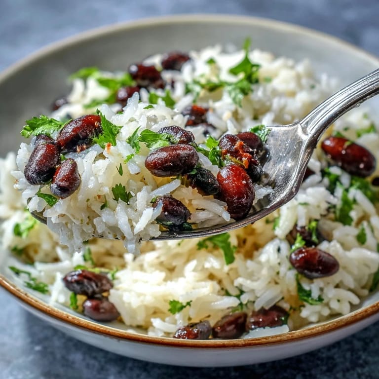 Steamed Coconut Lime Rice with beans, a sprinkle of lime zest and cilantro.