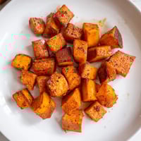 Golden, caramelized Roasted Sweet Potatoes, a simple side dish with crispy edges and savory spices.