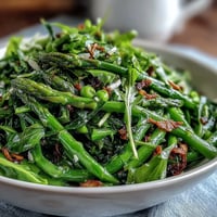 Shaved asparagus and pea salad with lemon dressing, a fresh spring dish with crisp ribbons, sweet peas, and tangy citrus vinaigrette.